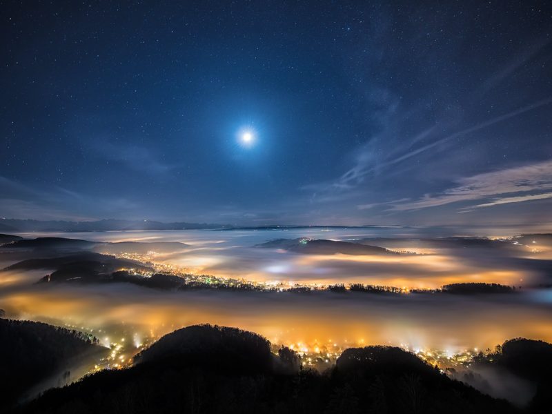 Bright City Lights Under Dense Fog